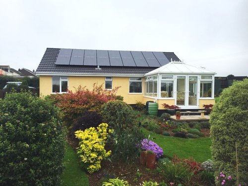 Image of a house with a solar panel install that we have done